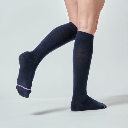 Knee-high compression socks in solid navy with a half-cushion design and a pink accent at the toe.