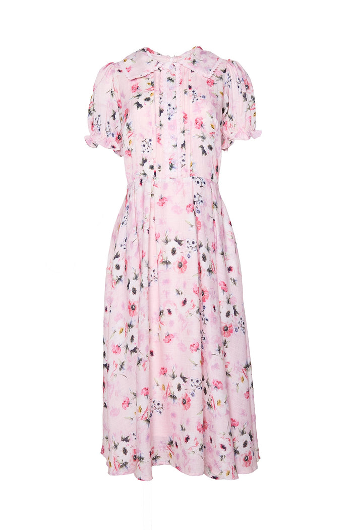 The Sophia Dress in Roselyn Pink by Ivy City Co is a light pink midi dress with multicolor floral print, short puff sleeves, a fitted waist, and subtle bodice pleats. Made from soft cotton-linen, it's ideal for any occasion.