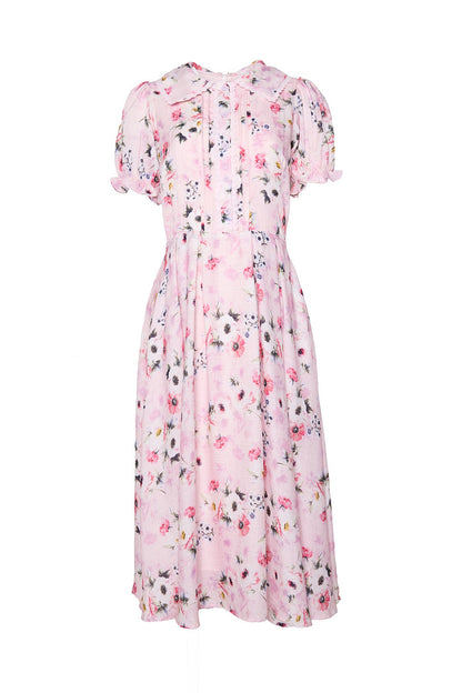 The Sophia Dress in Roselyn Pink by Ivy City Co is a light pink midi dress with multicolor floral print, short puff sleeves, a fitted waist, and subtle bodice pleats. Made from soft cotton-linen, it's ideal for any occasion.