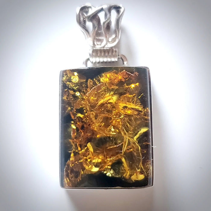 rectangular green amber pendant in sterling silver frame