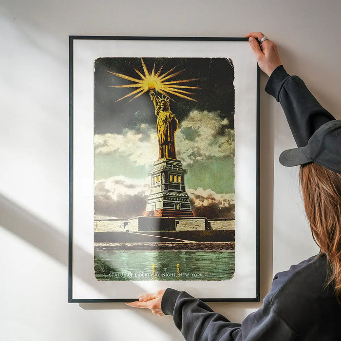 Statue Of Liberty Vintage Illustration Print being hung on a wall in a black frame