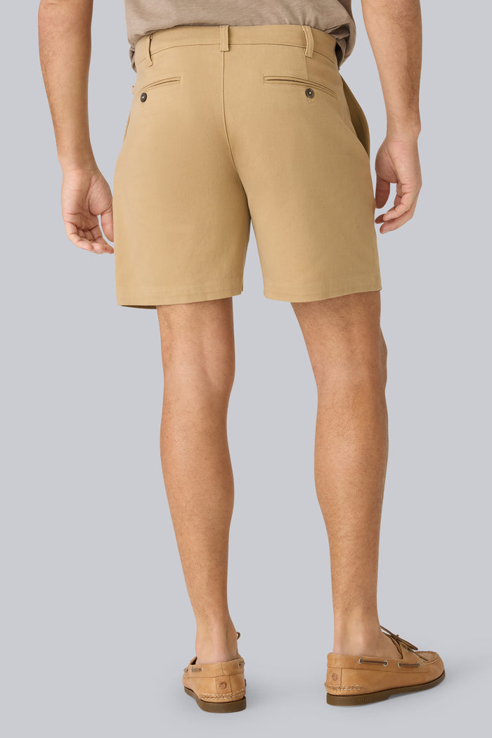 Back view of a man wearing Stretch Twill Chino Shorts 7" in Sisal