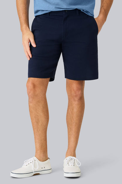 Front view of a man wearing Stretch Twill Chino Short 9" in Night Sky