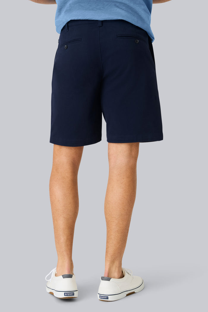 Back view of a man wearing Stretch Twill Chino Short 9" in Night Sky