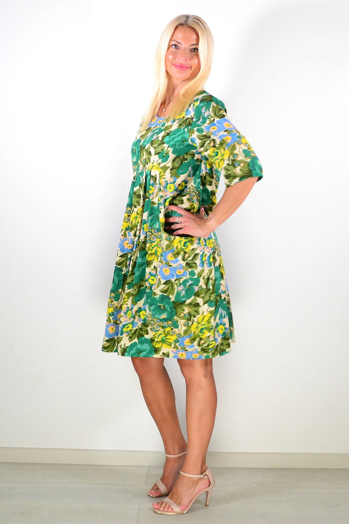 Summer Green Delight Tunic Dress by Hourglass, lightweight green tunic with floral pattern, displayed on a hanger.