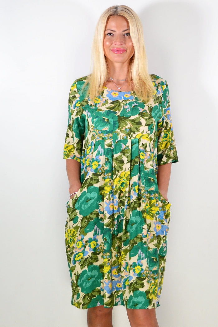 Green Summer Delight Tunic Dress by Hourglass, lightweight and flowing fabric, with a relaxed fit and vibrant green color.
