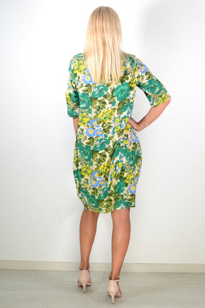 Green summer tunic dress by Hourglass featuring lightweight fabric, relaxed fit, and stylish design perfect for warm weather.
