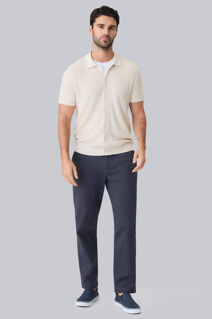 Full front view of a man wearing Tech Linen Button Up Sweater Polo in Latte Heather