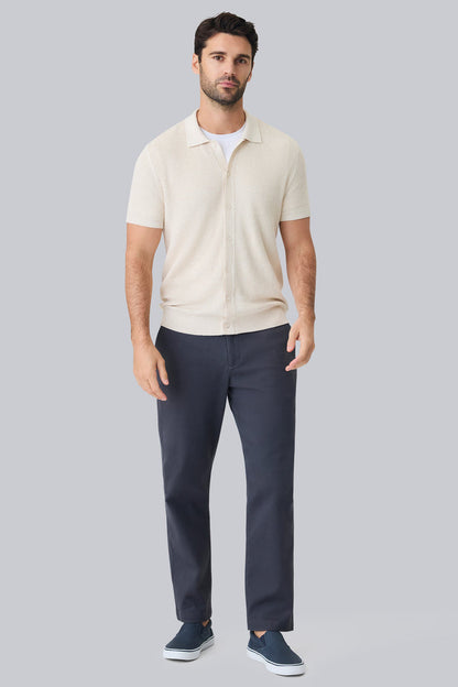 Full front view of a man wearing Tech Linen Button Up Sweater Polo in Latte Heather