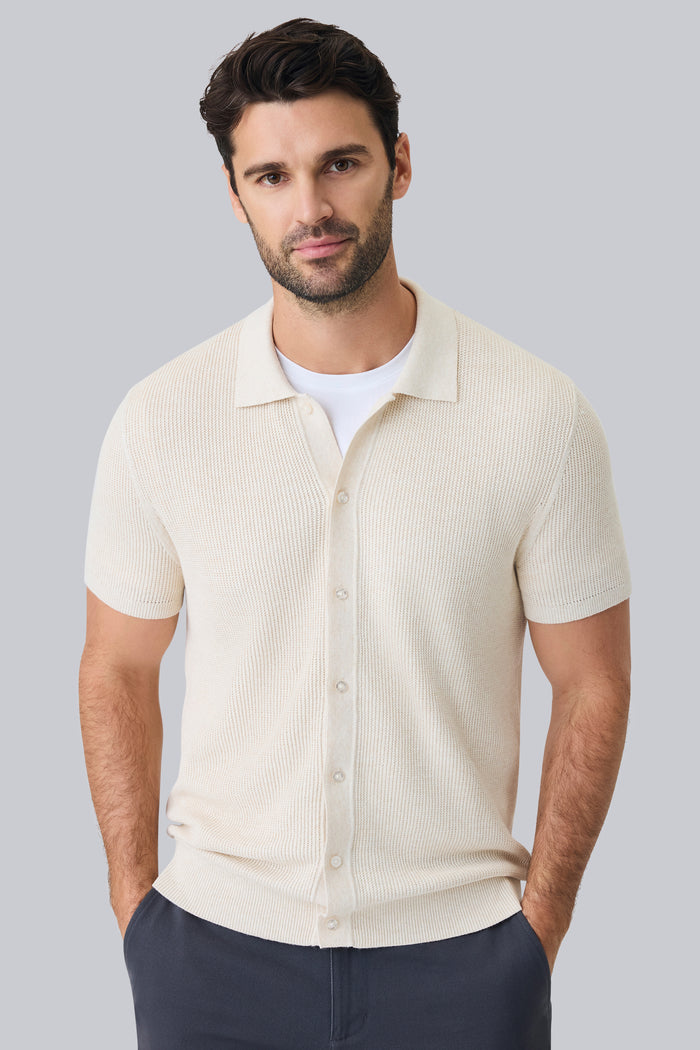 Front view of a man wearing Tech Linen Button Up Sweater Polo in Latte Heather
