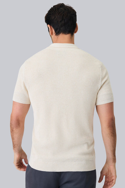 Back view of a man wearing Tech Linen Button Up Sweater Polo in Latte Heather