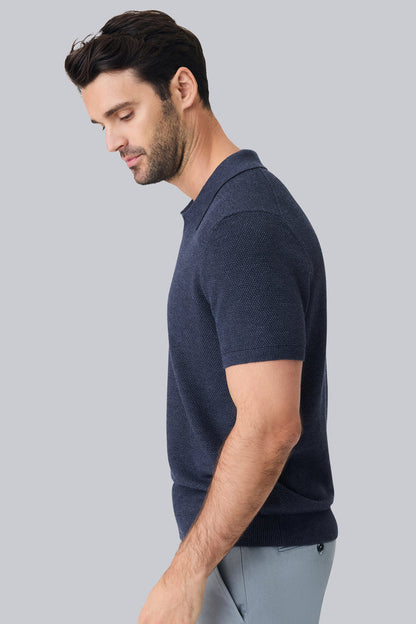 Side view of a man wearing Tech Linen Johnny Collar Sweater Polo in Navy Heather