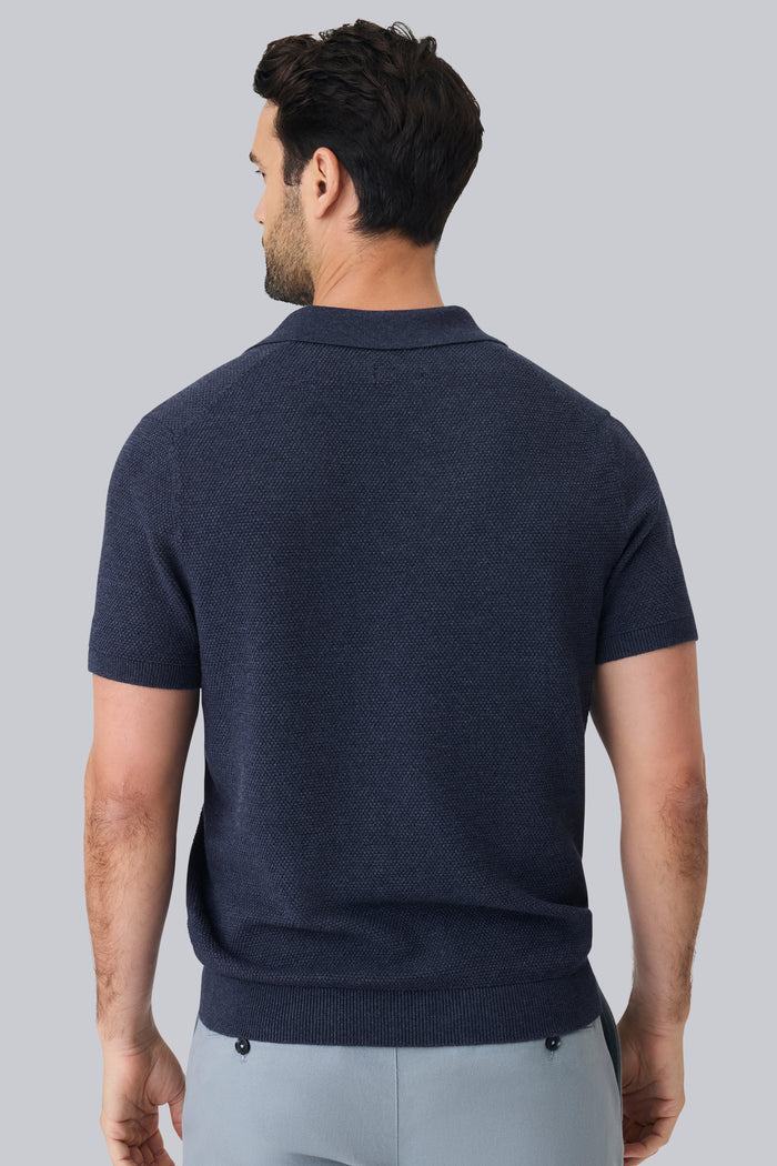 Back view of a man wearing Tech Linen Johnny Collar Sweater Polo in Navy Heather