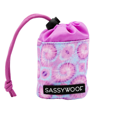 The Sassy Woof Treat Pouch - Purple Haze features a pink and purple tie-dye design with a front label, perfect for holding dog waste bags and pairing with your matching harness.