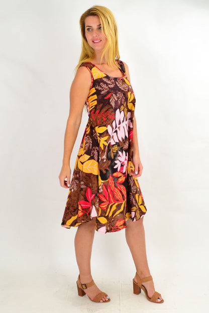Tropical autumn leaf print linen cotton tunic dress by Ruby Rain, shown on a model with a relaxed fit and earthy tones.