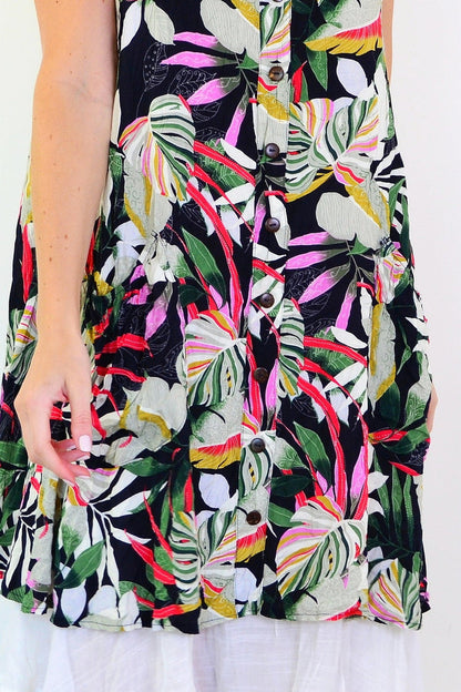 Missy Q tropical forest leaf crinkle tunic dress with vibrant leaf print and relaxed fit, displayed on a hanger.