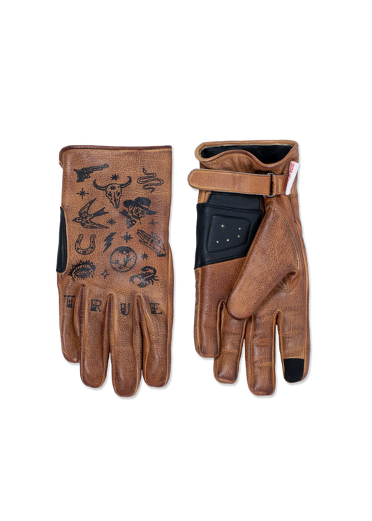 Brown leather gloves with black tattoo-style designs, including a bull skull and snake. The word "TRUE" is printed on the fingers.