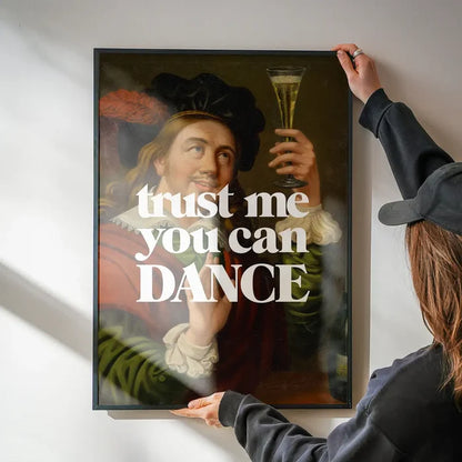 Trust Me You Can Dance Altered Art Print being hung on a wall in a black frame