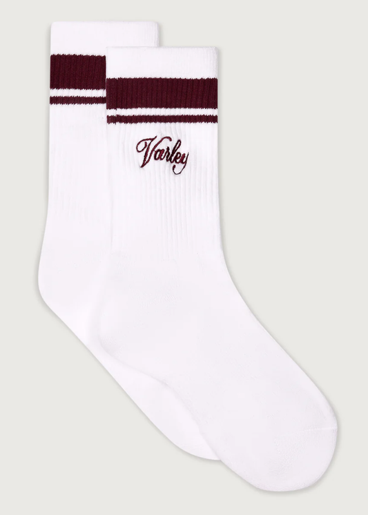 White crew socks with brown stripes and Varley logo
