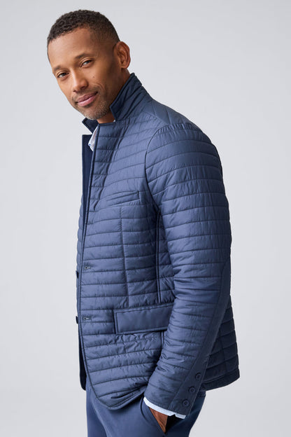 Side view of a man wearing Warmknit air blazer in Total Eclipse/True Black Liner