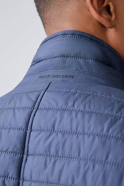Logo of Mack Weldon at the back of  Warmknit air blazer in Total Eclipse/True Black Liner