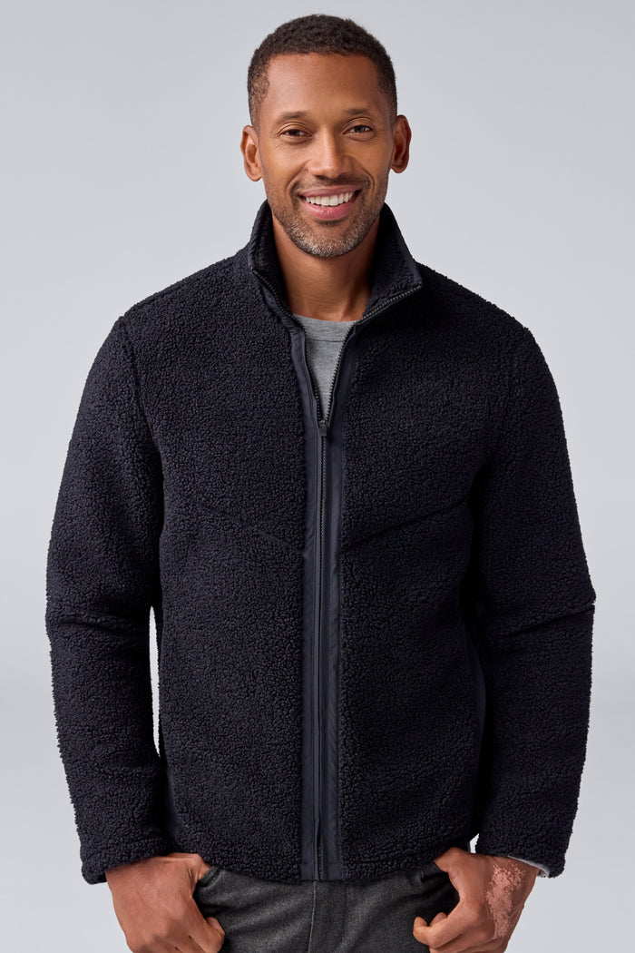 Front view of a man wearing WARMKNIT Sherpa Fleece in True Black