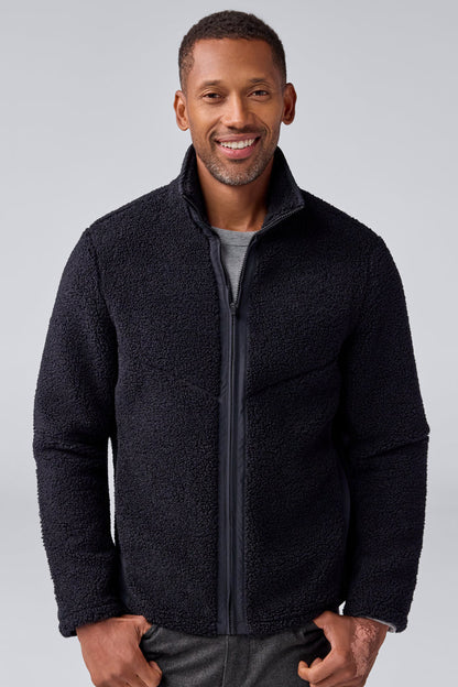 Front view of a man wearing WARMKNIT Sherpa Fleece in True Black