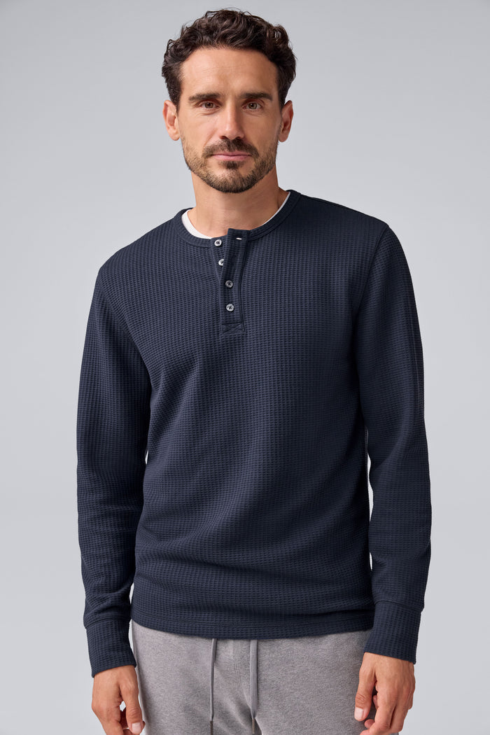 Front view of a man wearing Warmknit Waffle Long Sleeve Henley in Total Eclipse