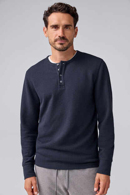 Front view of a man wearing Warmknit Waffle Long Sleeve Henley in Total Eclipse