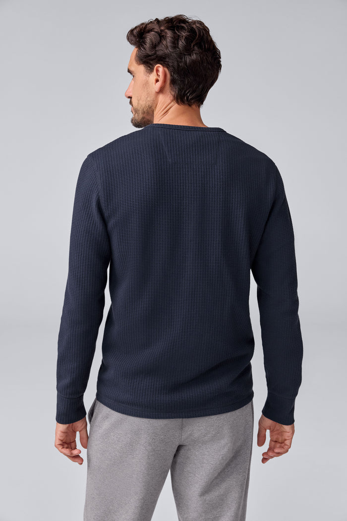 Back view of a man wearing Warmknit Waffle Long Sleeve Henley in Total Eclipse.