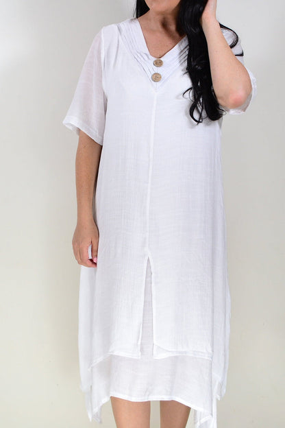 White summer tunic dress by La Mode featuring lightweight fabric and relaxed fit, displayed on a hanger against a neutral background.