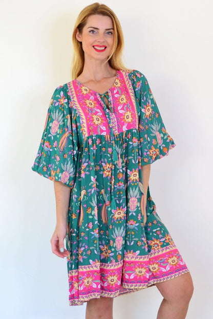 Dream Willow Bohemian Queen Dress tunic with flowy fabric and intricate patterns, styled as a bohemian fashion statement.