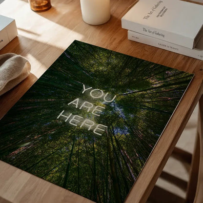 You Are Here neon-style graphic print featuring a low-angle forest canopy view on archival art paper.