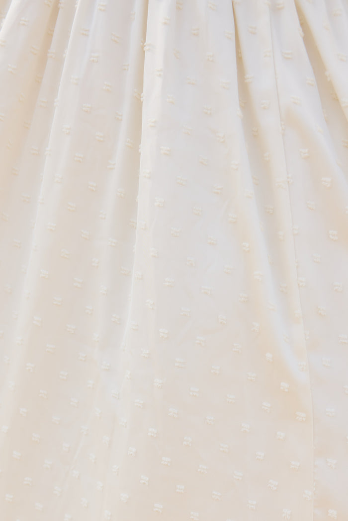 close up image of a textured white fabric.