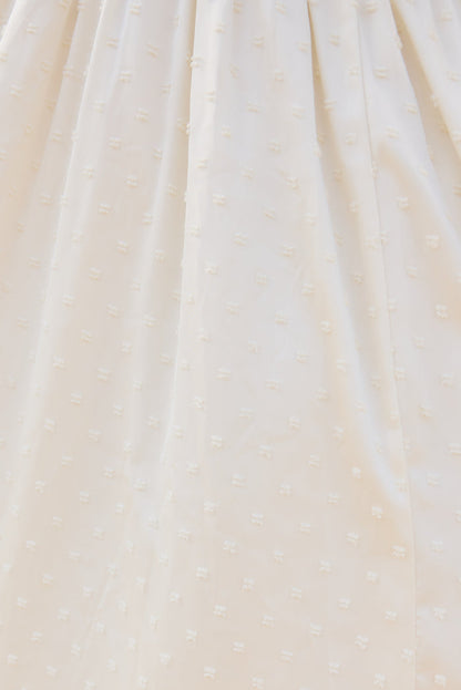 close up image of a textured white fabric.